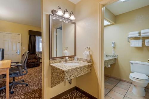 a bathroom with a sink and a toilet at Best Western Turquoise Inn & Suites in Cortez
