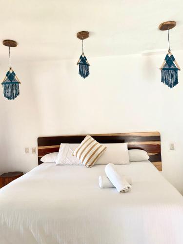 Katil atau katil-katil dalam bilik di Xcabal Hotel boutique
