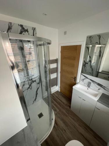 a bathroom with a shower and a sink at Georgian 3 bed house in historic town centre in Shrewsbury