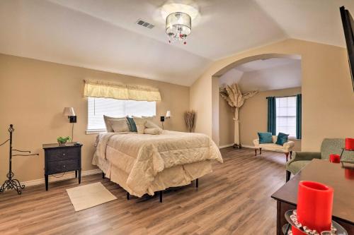 a bedroom with a bed and a living room at Charming Family Home about 16 Mi to Dtwn Dallas! in Cedar Hill