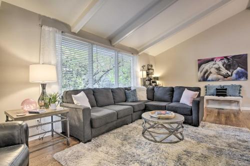 a living room with a couch and a table at Recently Renovated Raleigh Retreat with Patio! in Raleigh