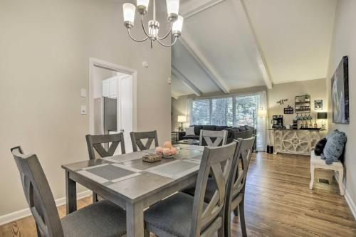 a dining room and living room with a table and chairs at Recently Renovated Raleigh Retreat with Patio! in Raleigh