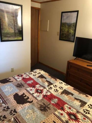 a bedroom with a bed with a quilt on it at 2 Bedroom 2 Bathroom - Blue Knob All Season Resort Condo in Claysburg