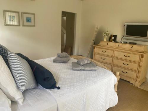 a bedroom with a bed with two towels on it at Barbados Luxury Villa with Pool in Saint James