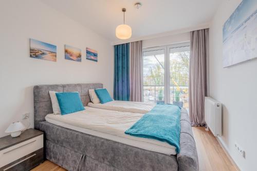 Postel nebo postele na pokoji v ubytování Apartament Wyspa Solna Kołobrzeg