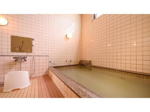 a bathroom with a pool of water and a toilet at Hotel Tamano - Vacation STAY 41648v in Otawara