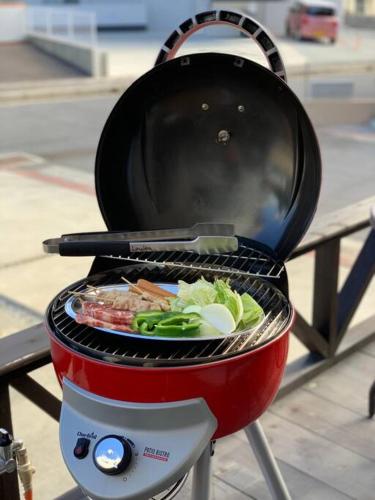 a grill with a pan on top of it at Laulea in Yaka