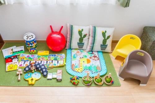 a toy table with a cake and other toys on it at Laulea in Yaka