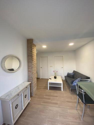 a living room with a couch and a table at CASA PAULA in Murcia