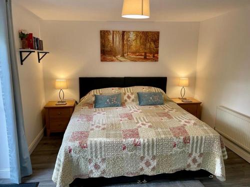 a bedroom with a large bed with two night stands at La Casita in Hale