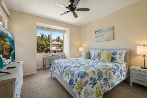 a bedroom with a bed and a window at Fairways at Mauna Lani by South Kohala Management in Waikoloa