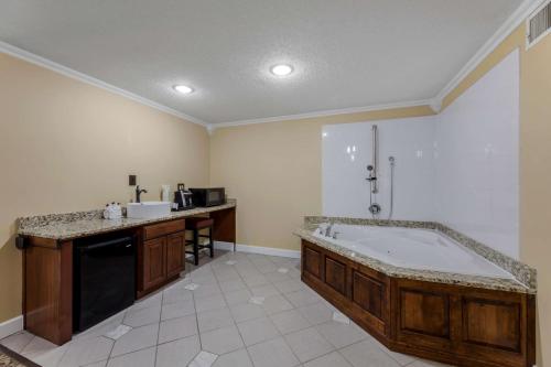 a large bathroom with a tub and a sink at Best Western Plus Wooster Hotel & Conference Center in Wooster