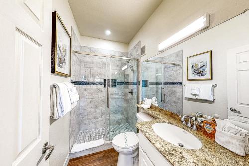 a bathroom with a shower and a toilet and a sink at Paradise Valley Vacation Home in Phoenix