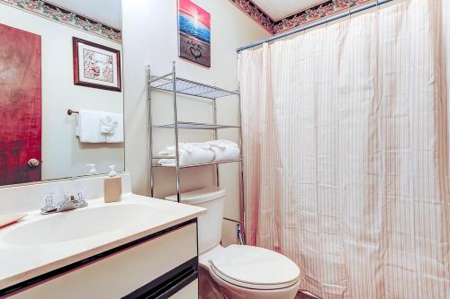 a bathroom with a toilet and a sink and a shower at Fairway Village - B6 in Myrtle Beach