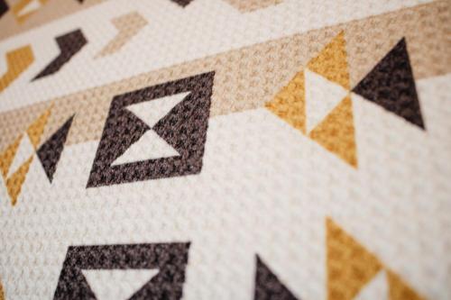 a close up of a tile floor with geometric patterns at Hostal Namaste in Salta