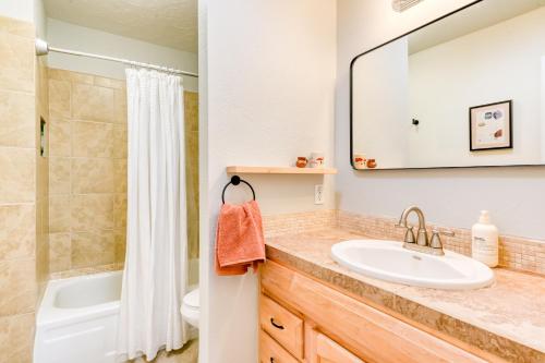 a bathroom with a sink and a shower at Casita Colibri in Santa Fe