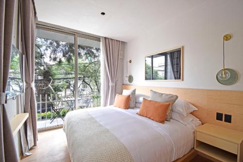 Postel nebo postele na pokoji v ubytování Boutique Hotel Durango219