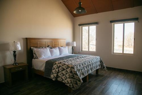 Ein Bett oder Betten in einem Zimmer der Unterkunft Montelago Cabañas & Resort