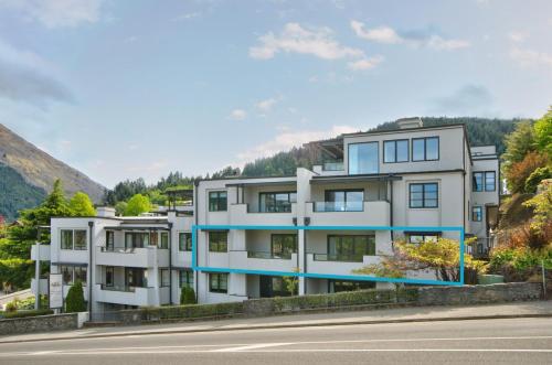an apartment building on the side of a road at The Glebe Apartments in Queenstown