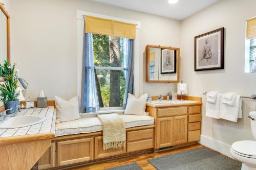 a bathroom with a sink and a window at The American Dream in Lakewood