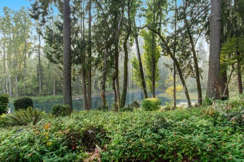 a garden with trees and bushes in a park at The American Dream in Lakewood