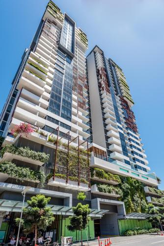 two tall buildings with plants on the side of them at Serain Residences On Merivale Street in Brisbane