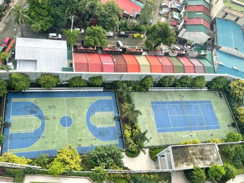 an overhead view of a tennis court and a tennis courtokemon at Cubao, Quezon City Condo Staycation (wifi and netflix ready) in Manila