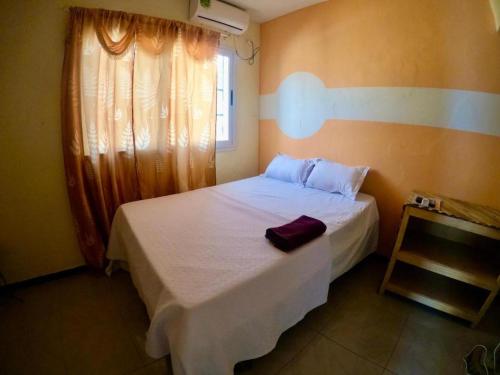 Ein Bett oder Betten in einem Zimmer der Unterkunft Kër Adja