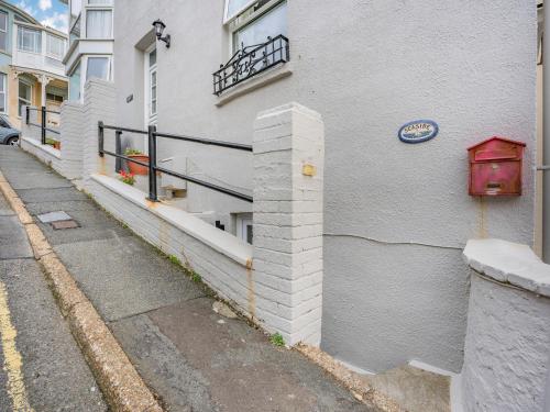 a building with a sign on the side of it at Seaside in Ventnor
