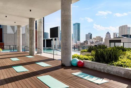 an outdoor yoga deck with a view of the city at The Elser Hotel Miami in Miami