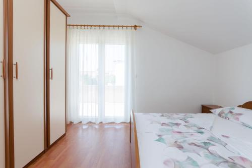 Posteľ alebo postele v izbe v ubytovaní Apartments Slavica