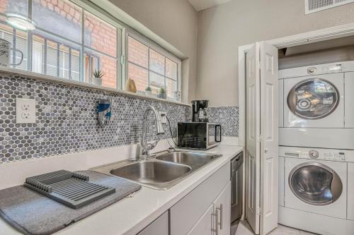 a kitchen with a sink and a washer and dryer at Close to All, Restful Duplex A in Downtown, UTEP, Hospitals in El Paso