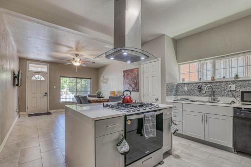 a kitchen with a stove top oven next to a sink at Close to All, Restful Duplex A in Downtown, UTEP, Hospitals in El Paso