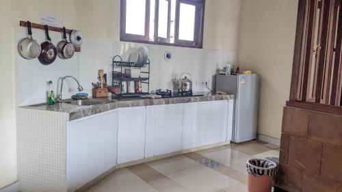 Kuchyň nebo kuchyňský kout v ubytování Ubud Dream