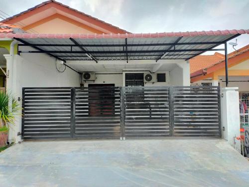 a gate in front of a house at D'Port DicksonMuslimOnly Homestay in Port Dickson