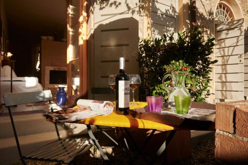 a bottle of wine sitting on a table on a patio at I Casaloni in Panzano