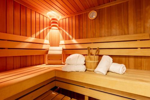 a sauna with two towels sitting on a shelf at der Sonnberg - Alpinlodges in Zell am See