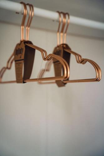 a pair of glasses hanging from a towel rack at Casa N in Arona