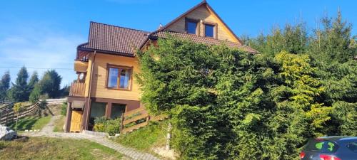 a house on the side of a hill at Solna Chata-dom na wyłączność Grota solna, balia, sauna, basen in Rajcza