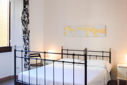 a bedroom with two beds and a painting on the wall at sleep easy in Florence