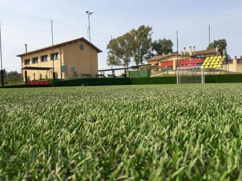 a field of green grass with a soccer goal at Il Casale Di Roma in Prima Porta
