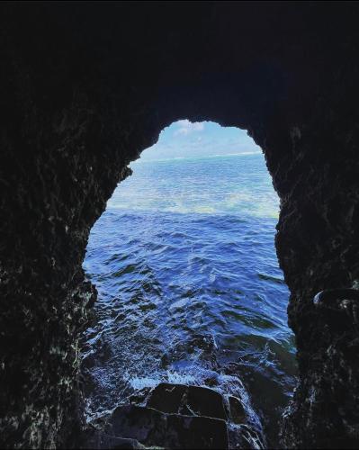 a view of the ocean from inside a cave at Mawe Zuri Resort in Watamu