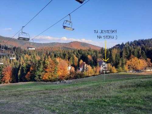 a ski lift with a sign that reads my station at Na stoku in Korbielów