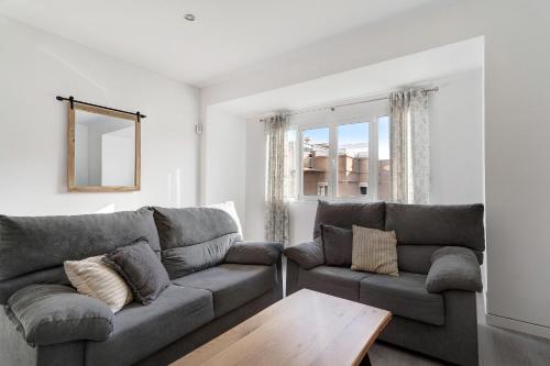 a living room with a couch and a table at Casa Manuela in Las Palmas de Gran Canaria