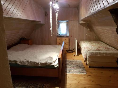 a bedroom with two beds in a attic at Haus herhönspatziert in Willmars
