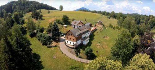 an aerial view of a large house on a hill at Penzion Na Výšinkách, Jetřichovice, České Švýcarsko in Jetřichovice
