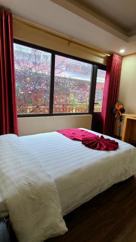 Ένα ή περισσότερα κρεβάτια σε δωμάτιο στο Dang Khoa Garden Inn