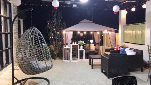 a room with a tent and a swing at Palompon kalimba de luna Villa Inn in Leyte