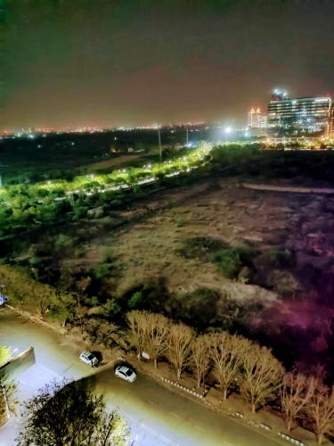 an aerial view of a city at night at Entire Studio Apt/Suite near Mall/Metro/ExpoMart in Noida