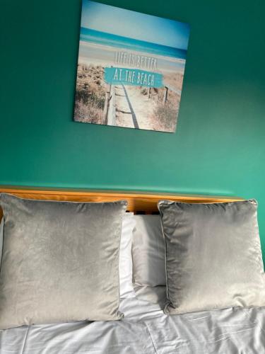 a bedroom with a bed with a poster on the wall at Toll Bridge Studio in Selby